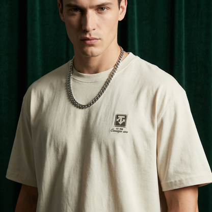 Close-up of WEARON Heritage Crest Tee in Ivory showing chest crest print.
