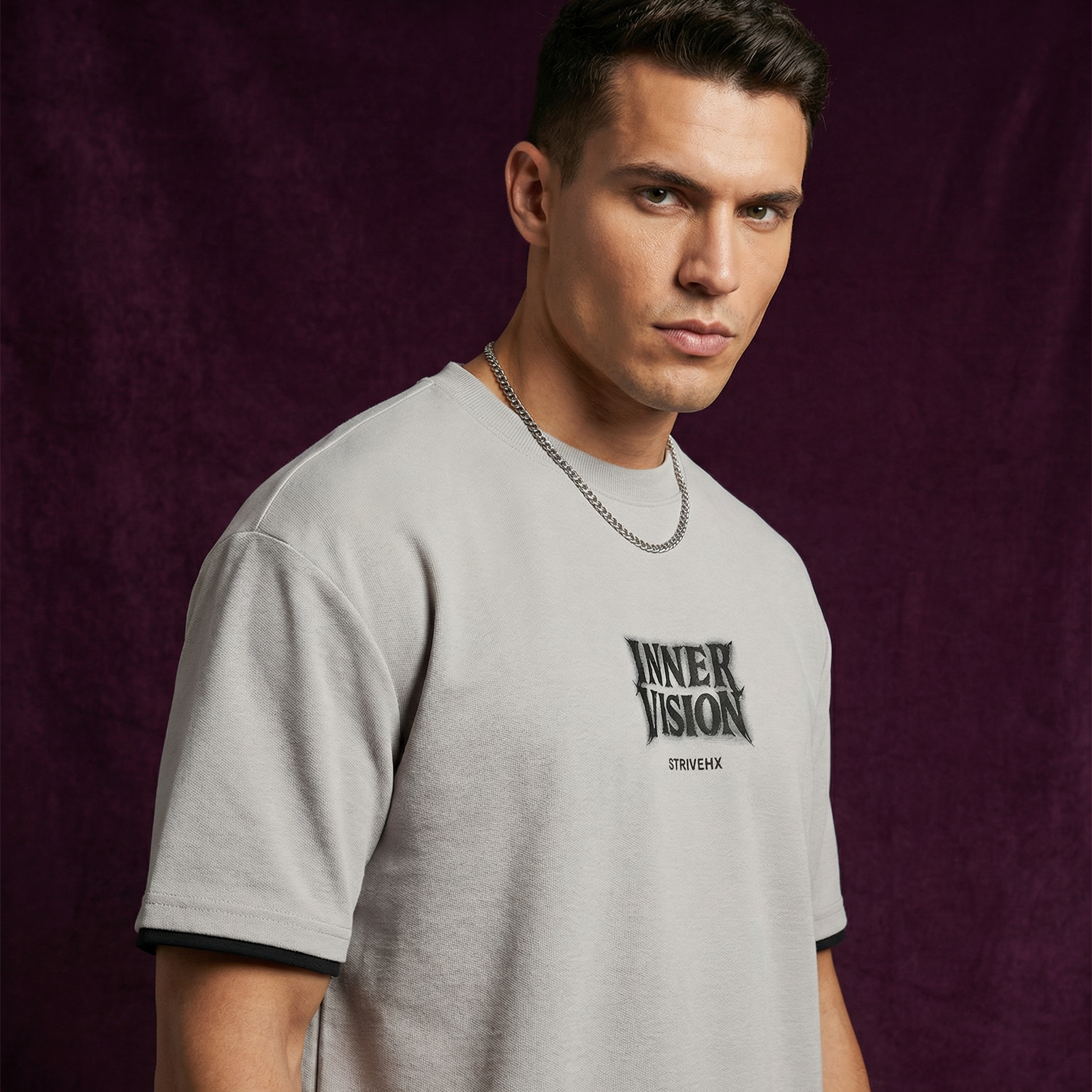Close-up of WEARON Inner Vision Tee in Gray showing typographic chest print and cuff trim.