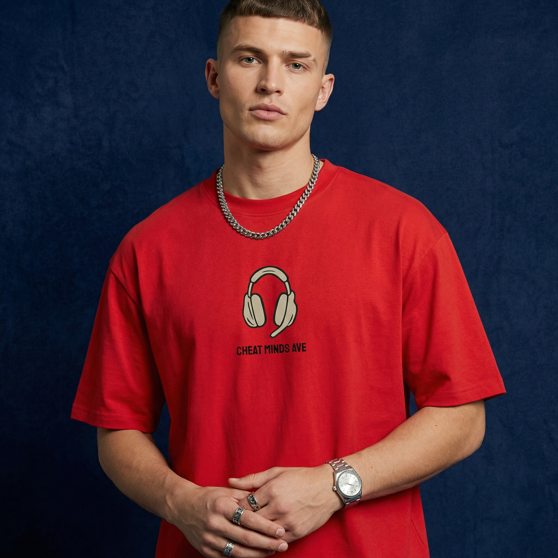 Close-up of WEARON Headphones Tee in Red with illustrated headphones motif, navy backdrop.