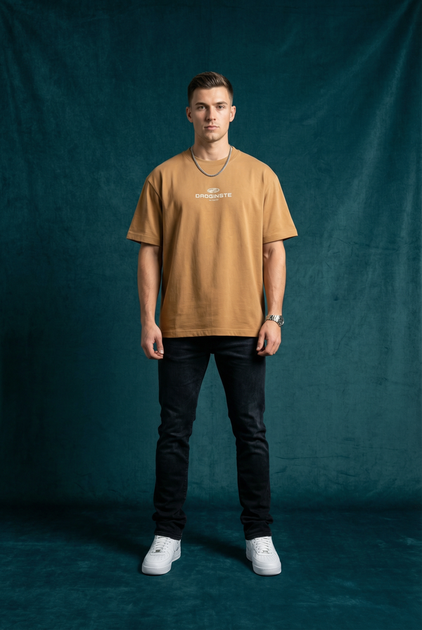 Man wearing WEARON Sport Logo Tee in Tan, full body, deep teal velvet backdrop.