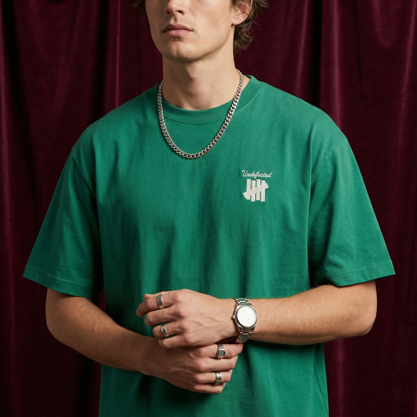 Close-up of WEARON 4-Bar Embroidered Tee in White showing chest emblem.