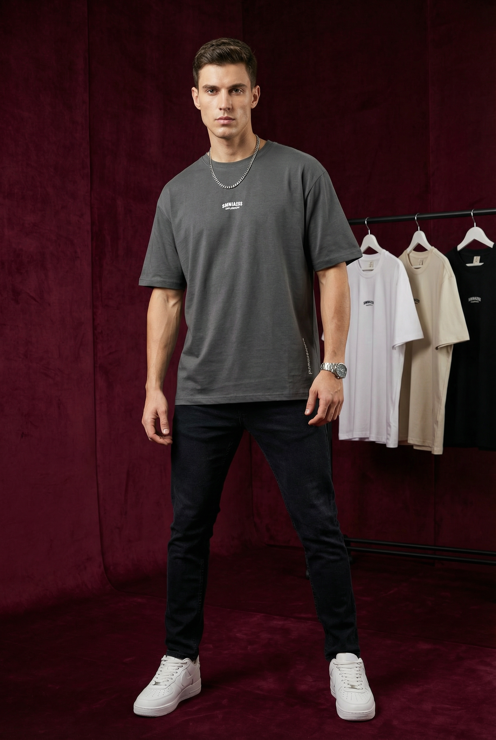 Close-up of WEARON Explore Onward Tee in White showing chest typographic mark and side 'explore onward' print.