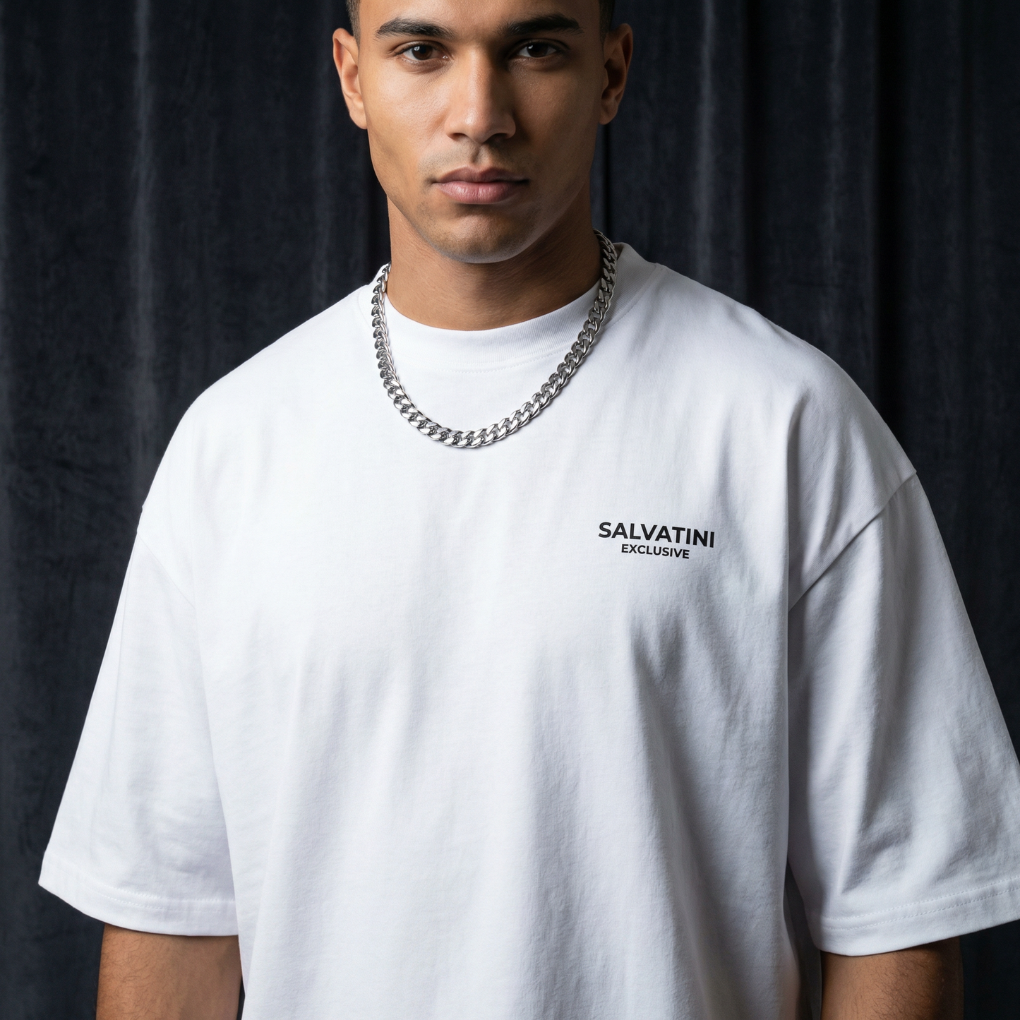 Close-up of WEARON Premium Logo Tee in White showing chest logo print, navy backdrop.