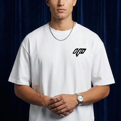 Close-up of WEARON Geometric Logo Tee in White with chest geometric emblem, deep blue velvet backdrop.