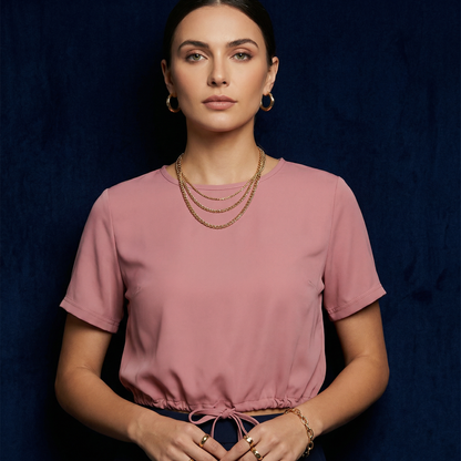 Close-up of WEARON Drawstring-Hem Top in Pink with self-drawstring hem, navy velvet backdrop.